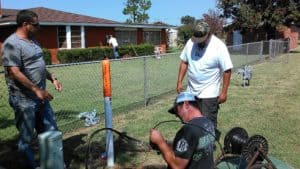 Image of technicians installing a new fiber optic line in Carnegie Oklahoma